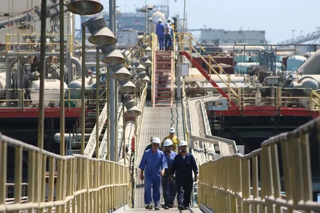 An oil tanker docked at a floating platform on Sept. 21, offshore from the southern Iraqi port city of Al Faw