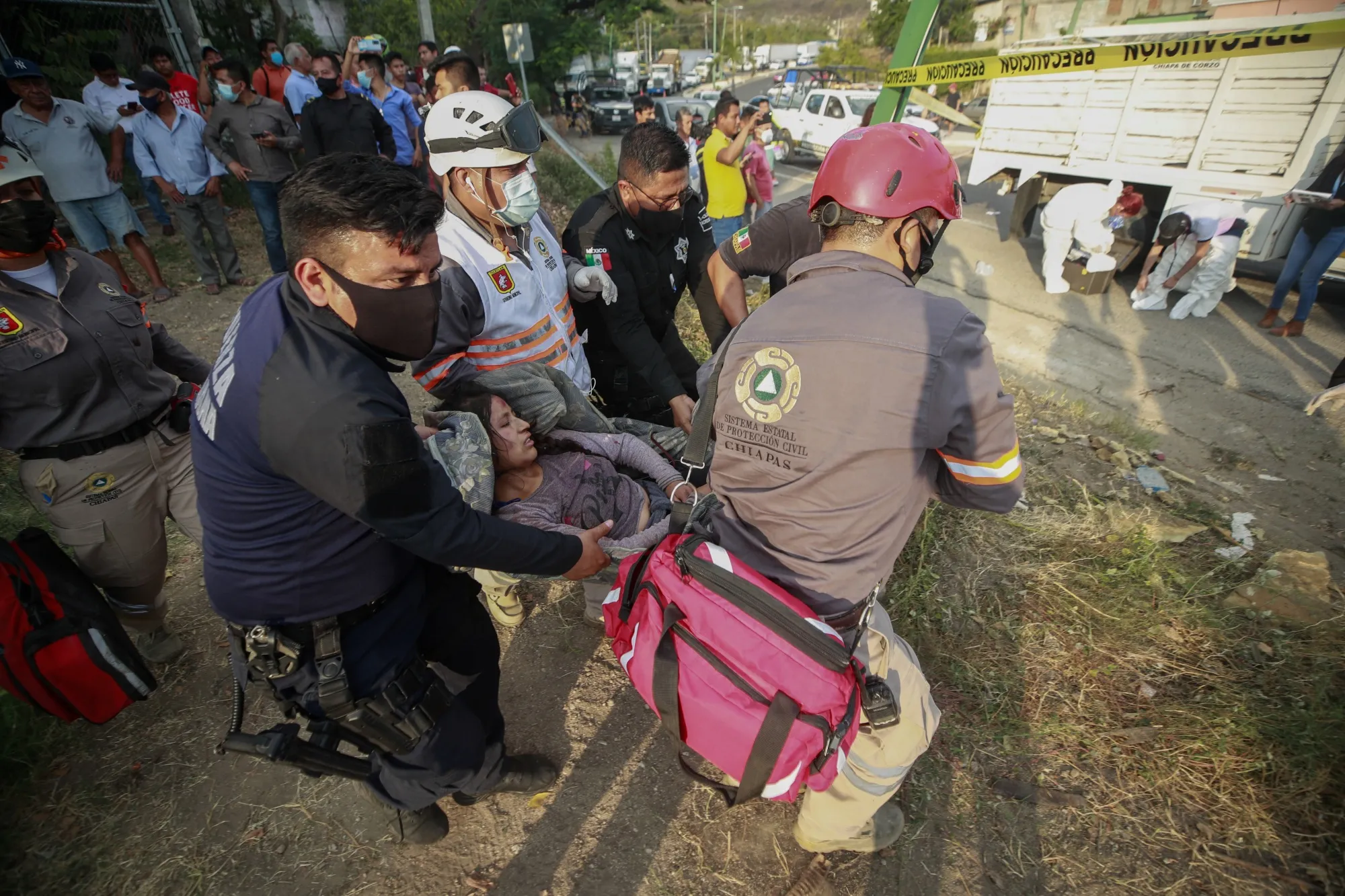 An injure person is moved by rescue personnel at an accident near Tuxtla Gutierrez,&nbsp;Mexico.