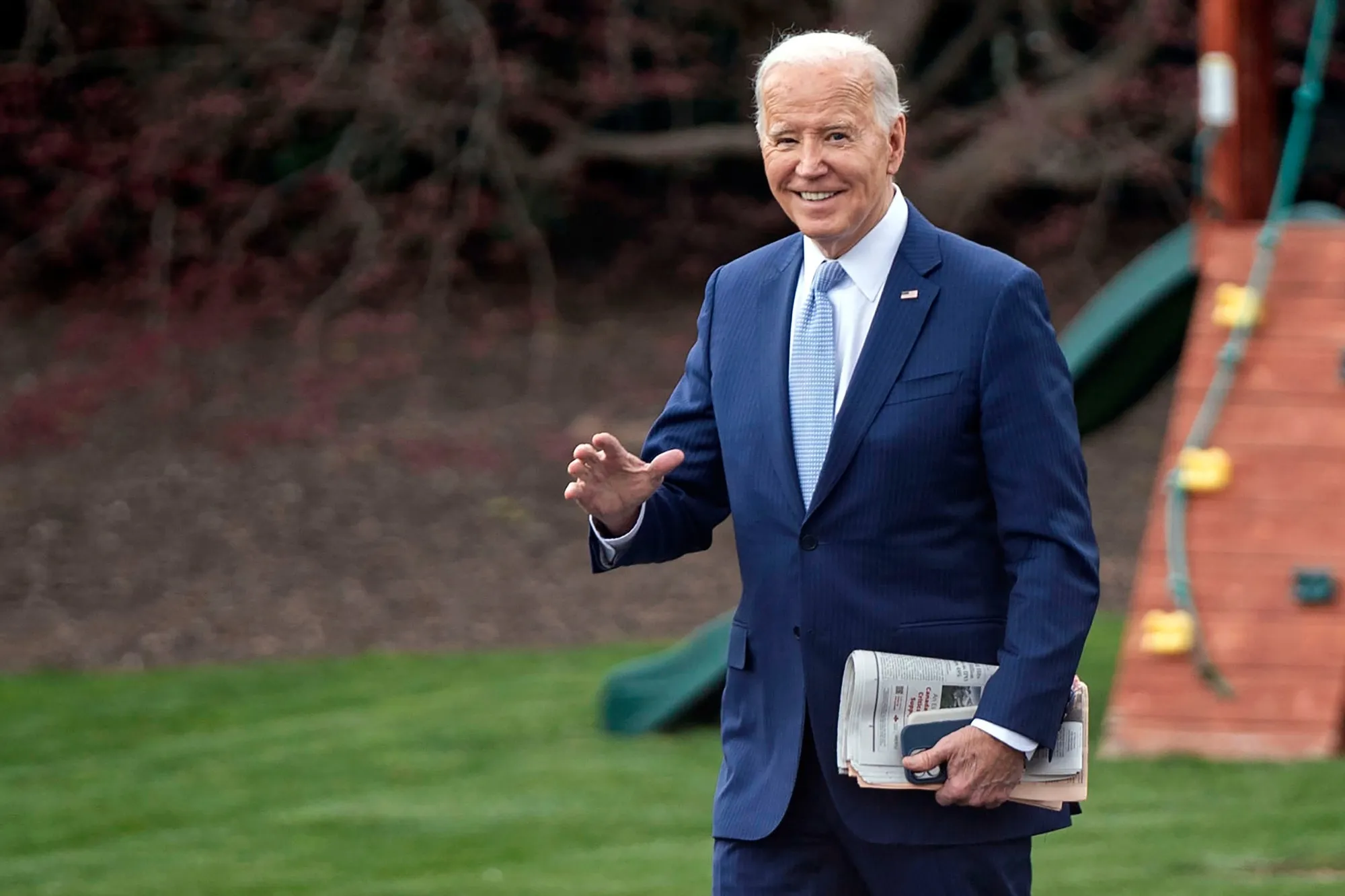 US President Joe Biden walks on the South Lawn of the White House before boarding Marine One in Washington, DC,&nbsp; on Friday.