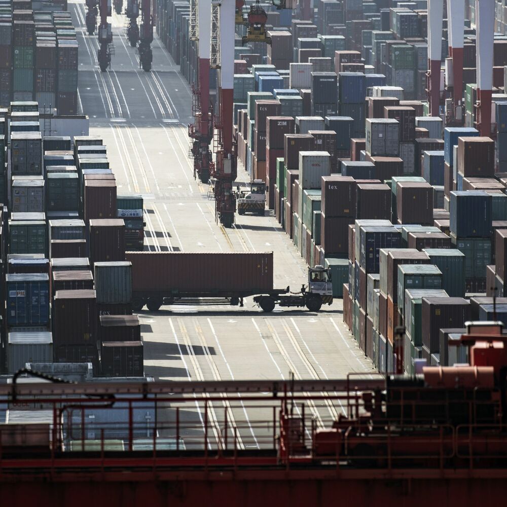 A truck transports a container at the Yangshan Deep Water Port in Shanghai, China.