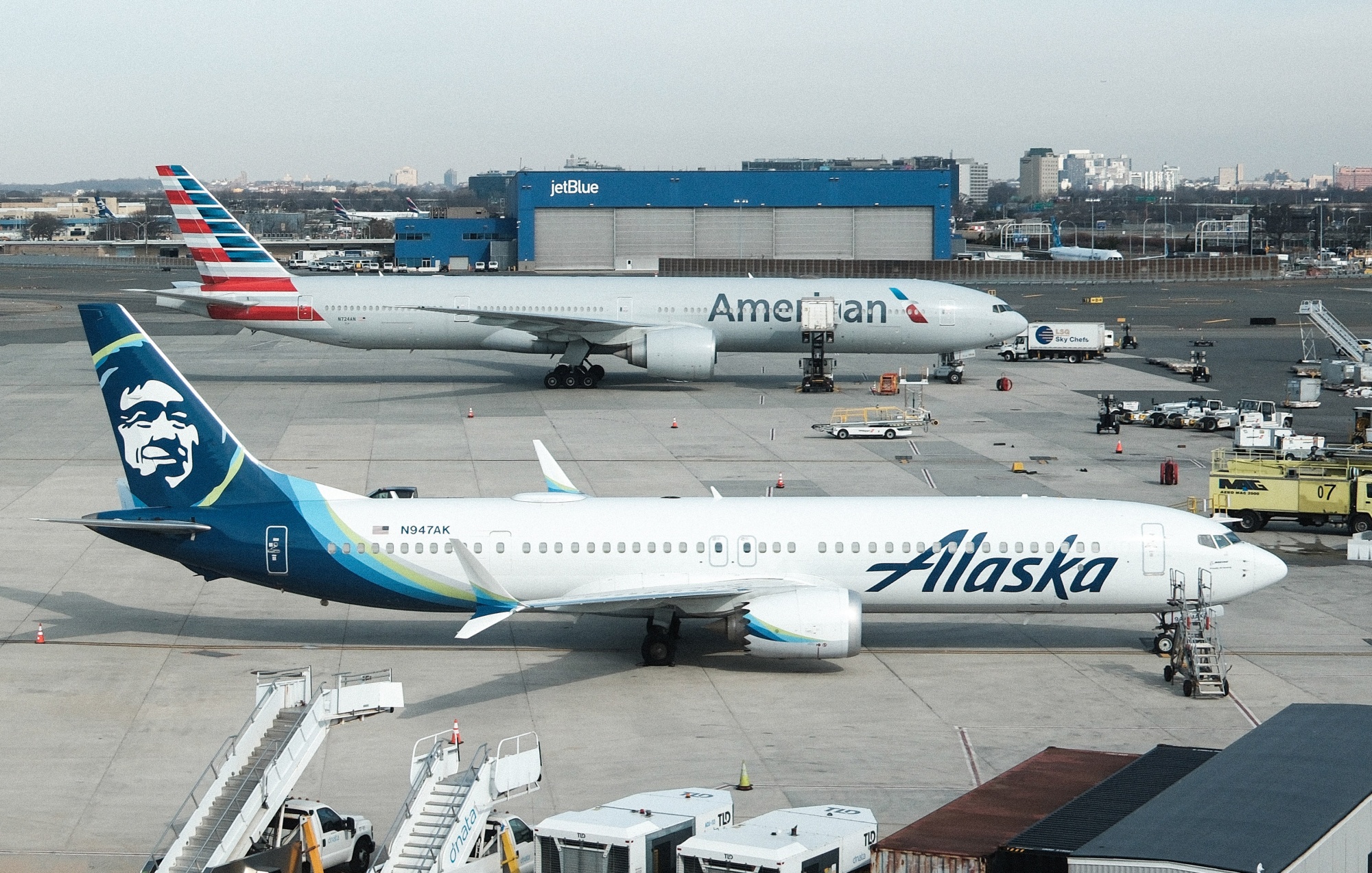 An Alaska Airlines plane and an American Airlines plane at John F. Kennedy Airport in New York.