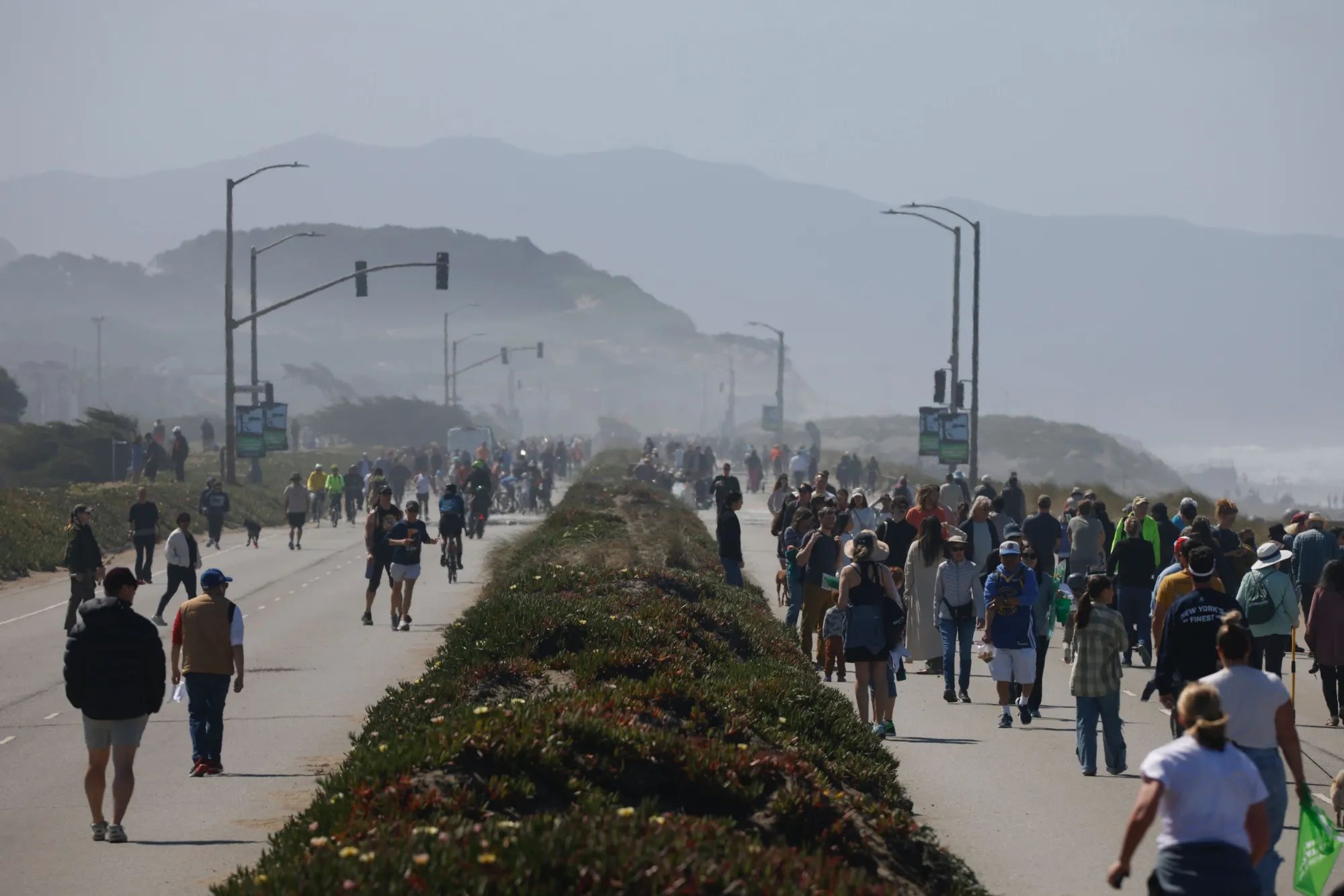 Visitors pack the former Great Highway during the grand opening of the Sunset Dunes Park in San Francisco on April 12. 