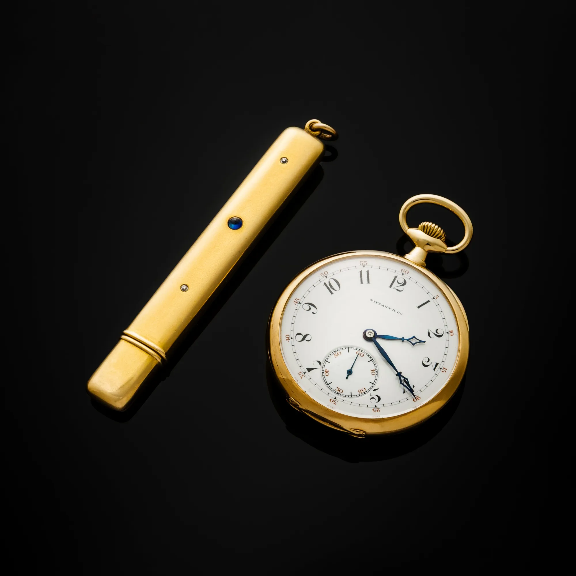 John Jacob Astor IV’s 18K gold Patek Philippe pocket watch, along with his gold pencil case.