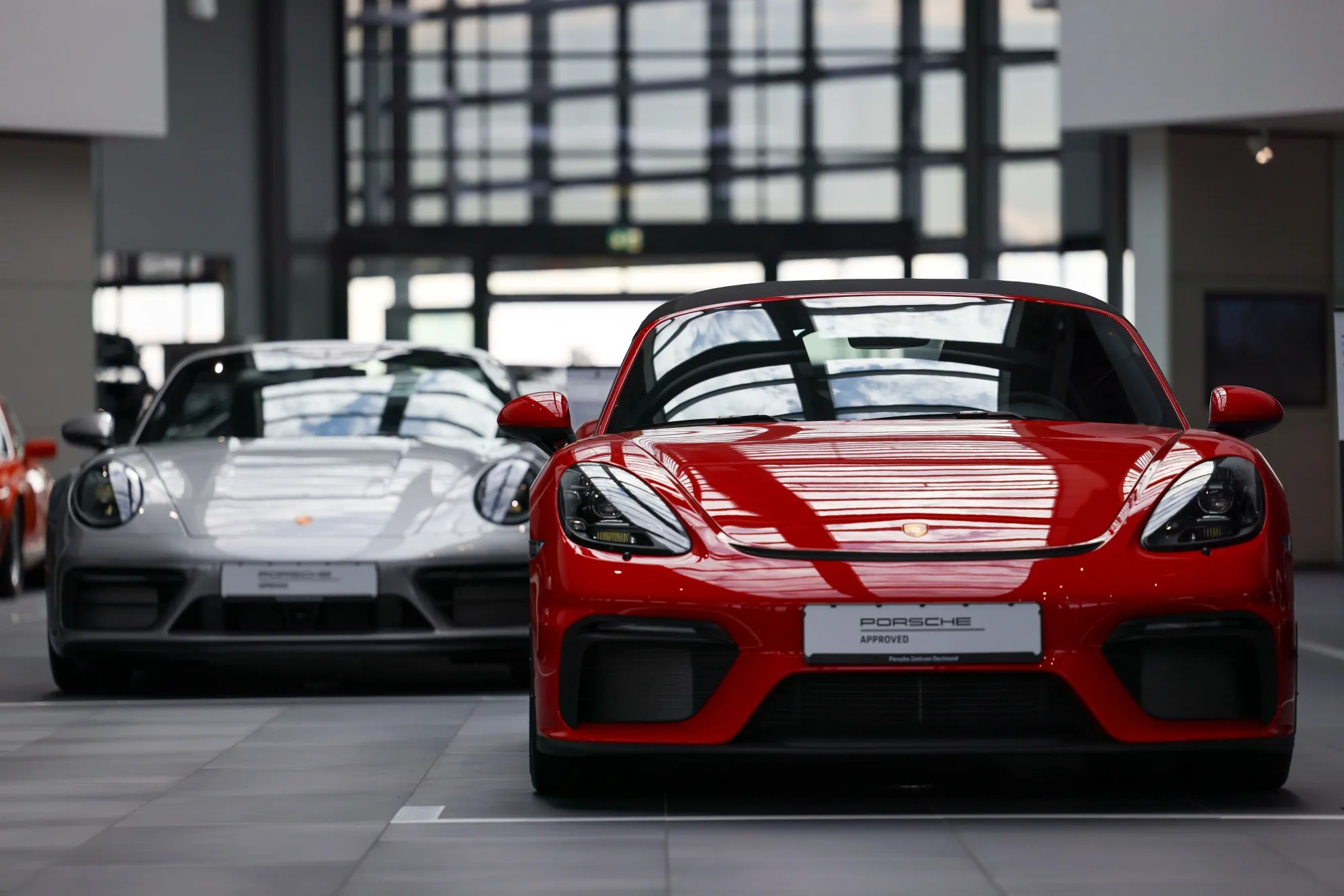 A Porsche 718 Spyder, right, in the Porsche SE showroom in Dortmund, Germany.