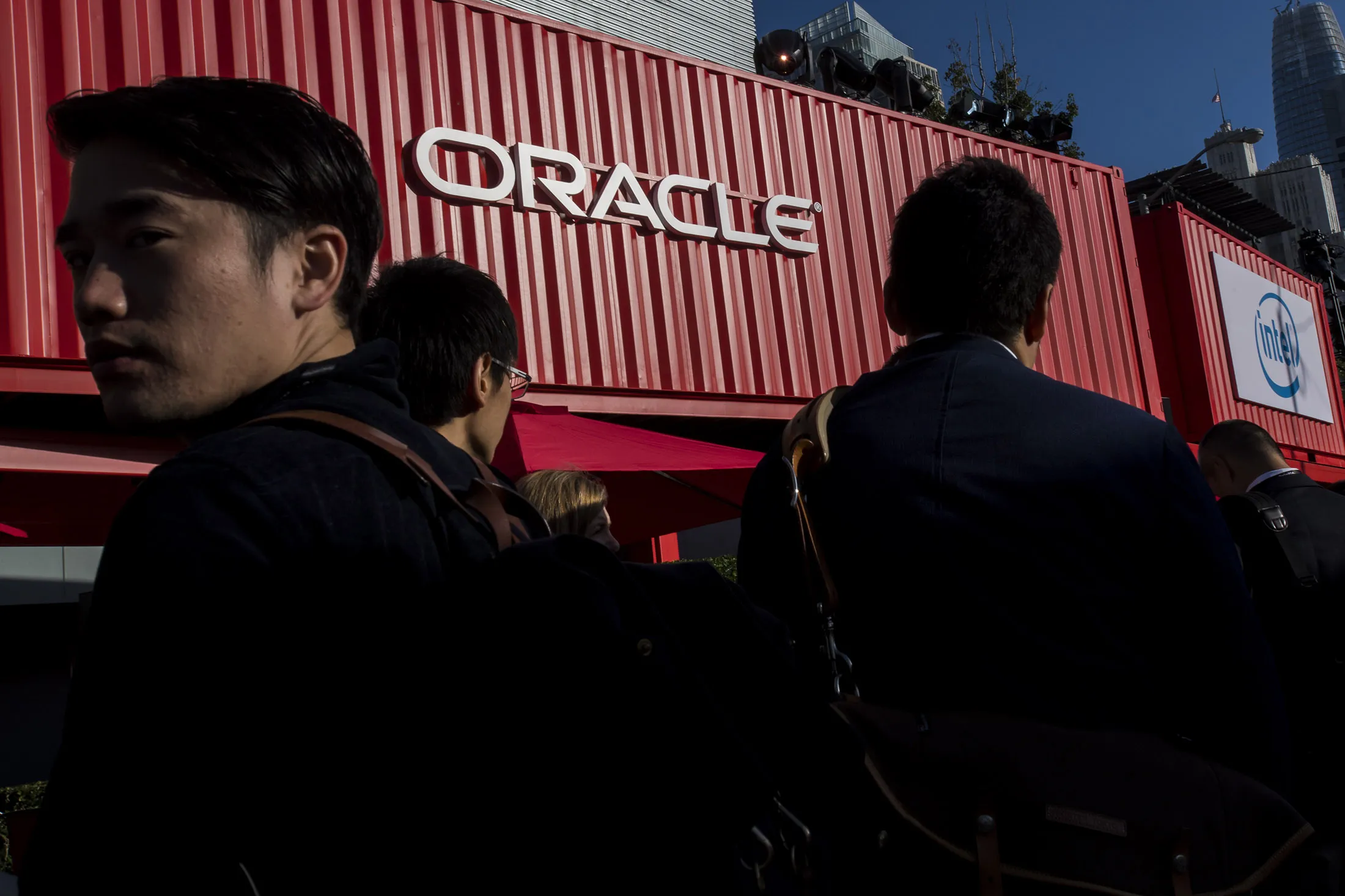 Attendees wait in line to enter the Moscone Center North building during an Oracle OpenWorld conference in San Francisco.