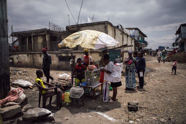 Janet Mutungi attends to customers at her street food stall.