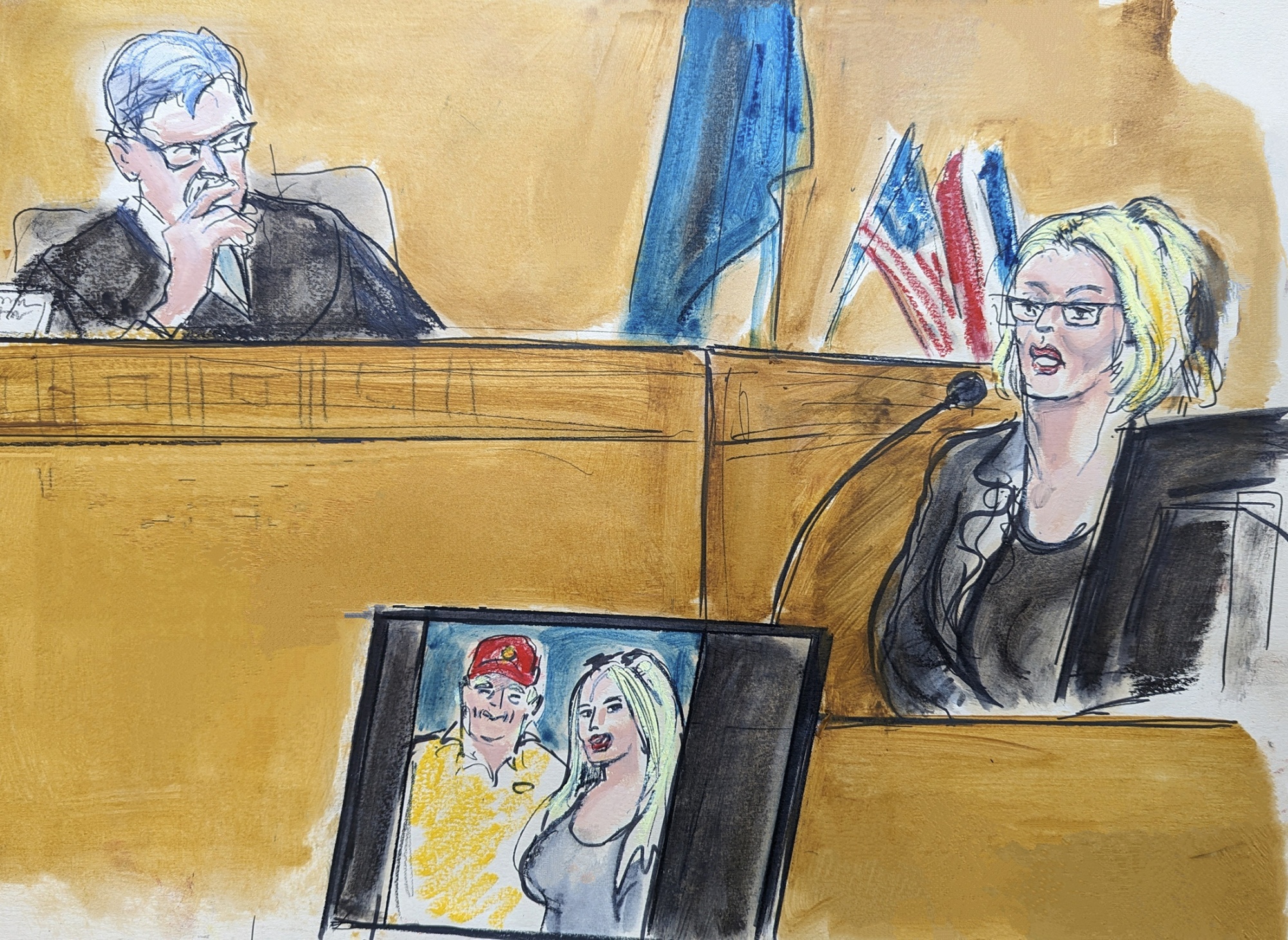 Adult film star Stormy Daniels testifies on the witness stand as Judge Juan Merchan looks on in Manhattan criminal court on May 7.