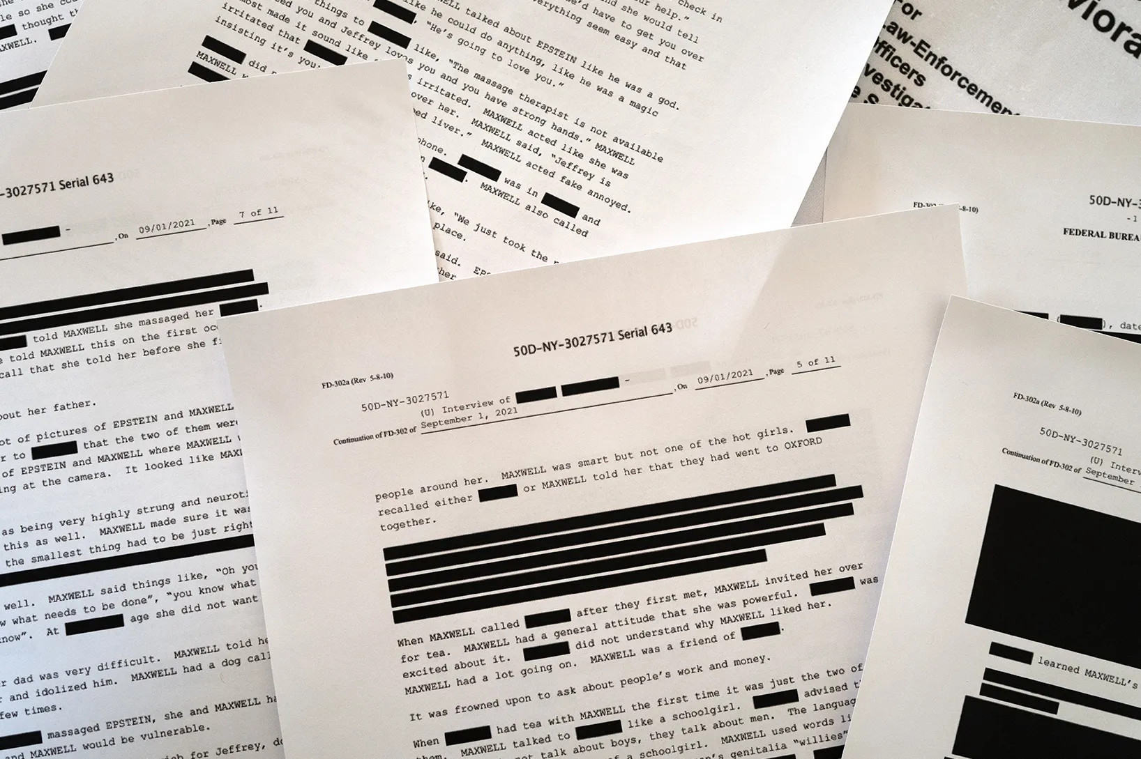 Printouts from the Epstein files released by the Department of Justice.