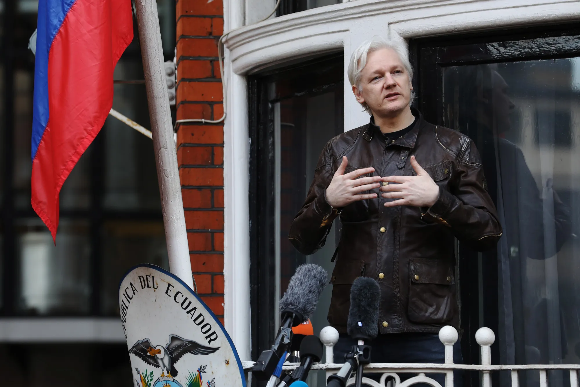 Julian Assange speaks to media and supporters from a balcony at the Ecuadorian embassy in London on May 19, 2017.