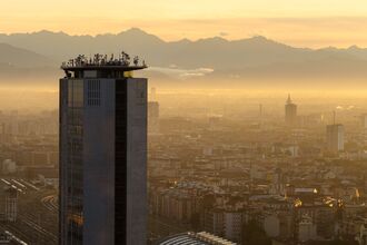 Pirelli Tower and Alps at sunrise