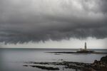 Rain clouds over St Mary's Lighthouse in Whitley Bay, near Newcastle, UK.