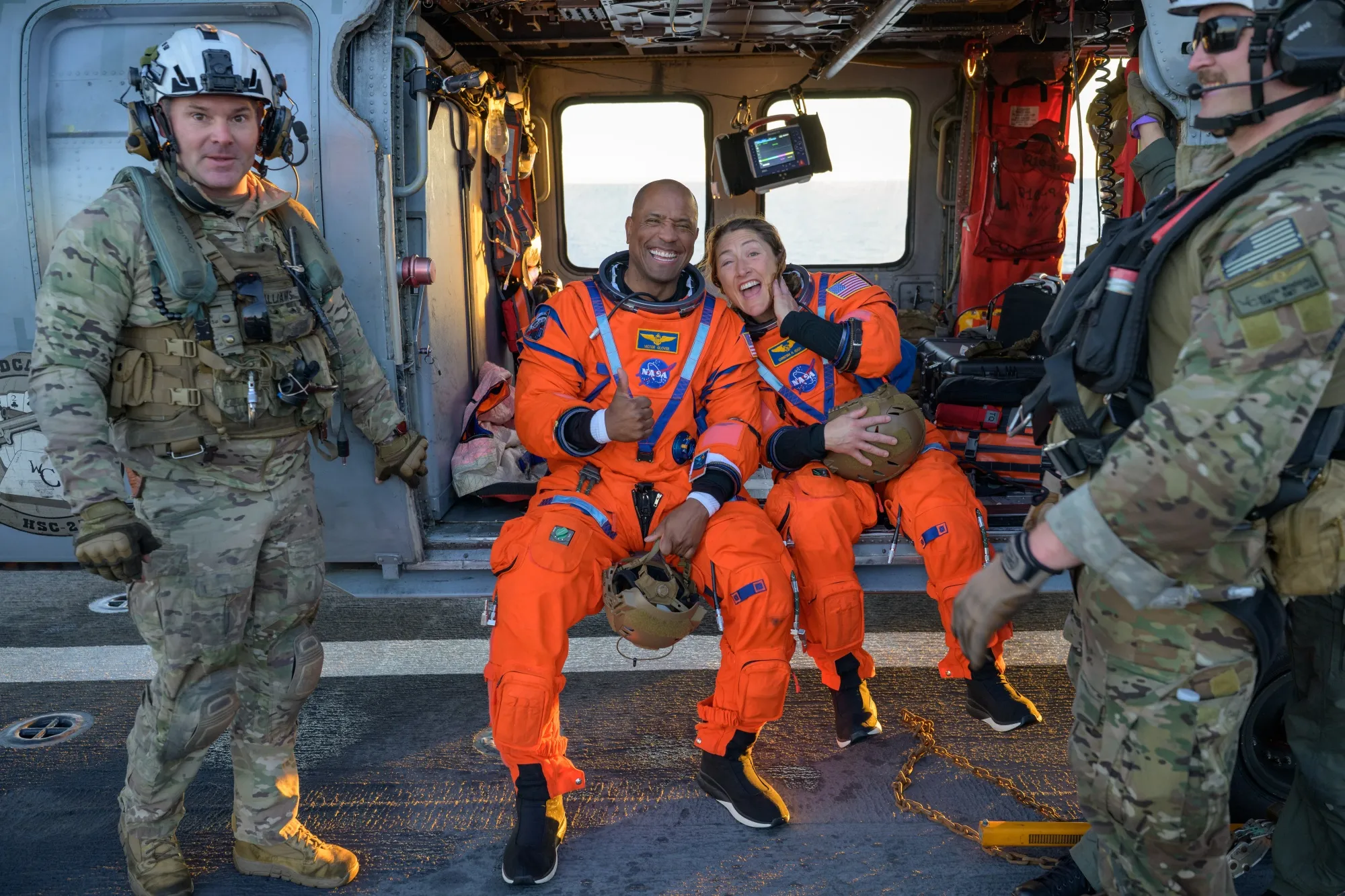 Welcome home: NASA astronaut Victor Glover, Artemis II pilot, left, and NASA astronaut Christina Koch, Artemis II mission specialist, on the flight deck of USS John P. Murtha after splashdown,&nbsp;April 10, 2026.&nbsp;