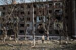 An elderly man stands in front of an apartment damaged by a missile explosion in Kramatorsk, eastern Ukraine.