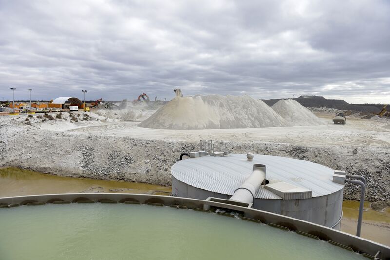 Lithium ore falls from a chute onto a stockpile in Widgiemooltha, Australia.