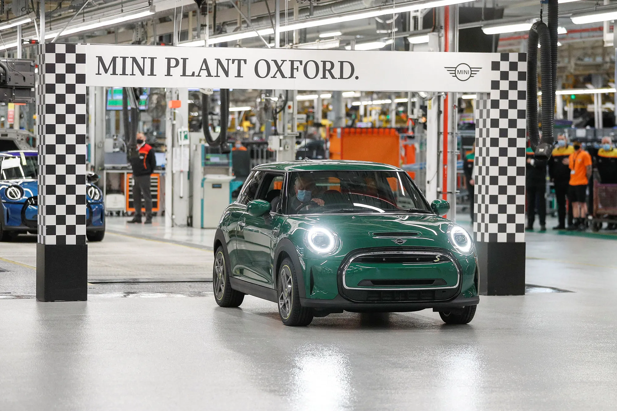 Prince Charles, drives a new Electric Mini off of the production line during his visit to the MINI plant in Oxford in 2021.