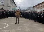 A man recruiting inmates at a Russian prison to fight in Ukraine in an undated video.