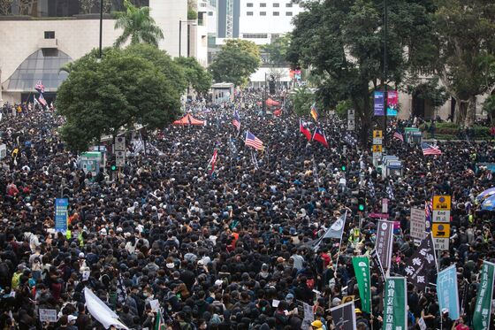 Moody’s Downgrades Hong Kong for ‘Inertia’ Over Protests