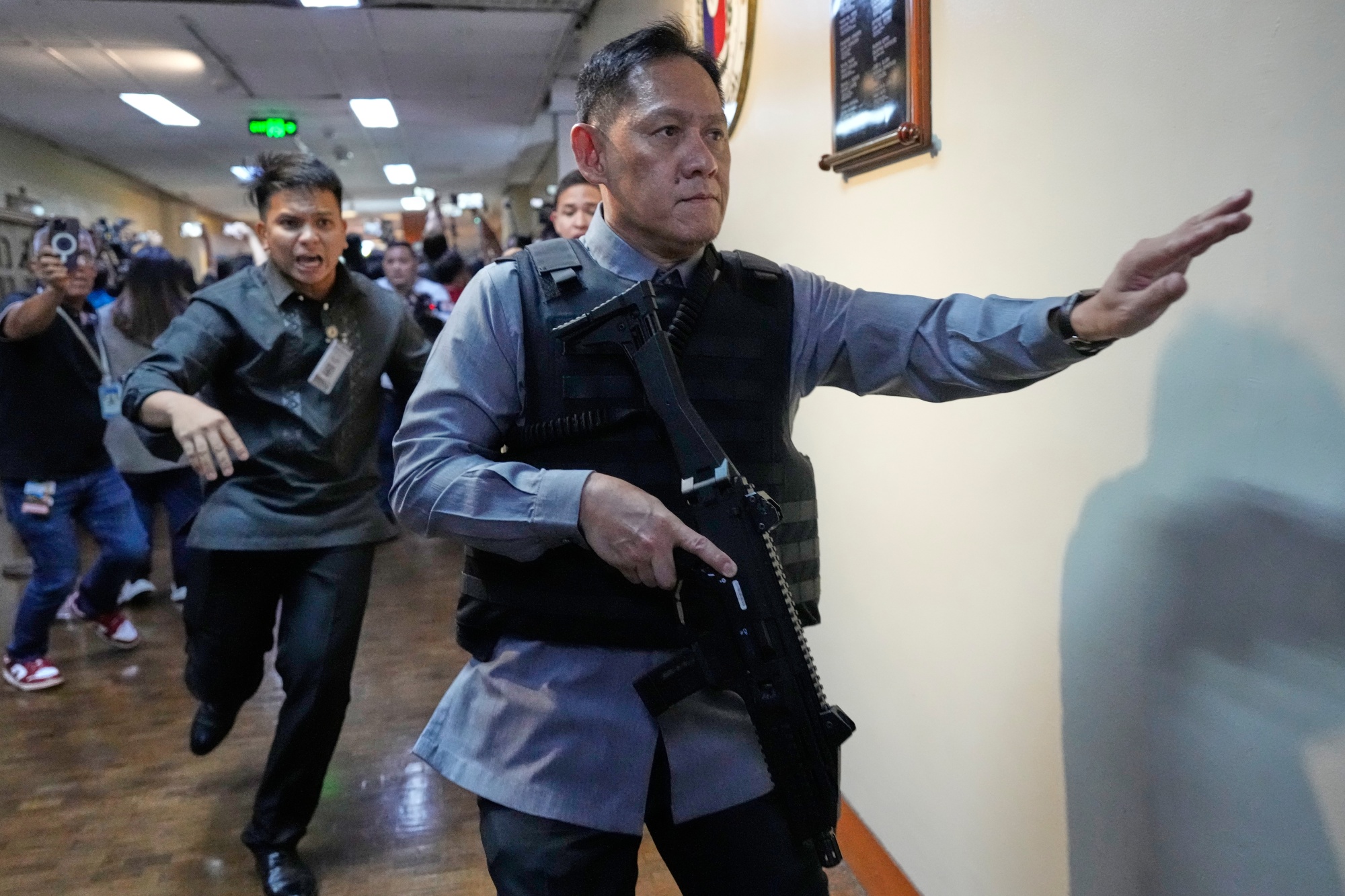Senate security officers respond after gunfire was heard in the Senate on May 13. Photographer: Aaron Favila/AP Photo