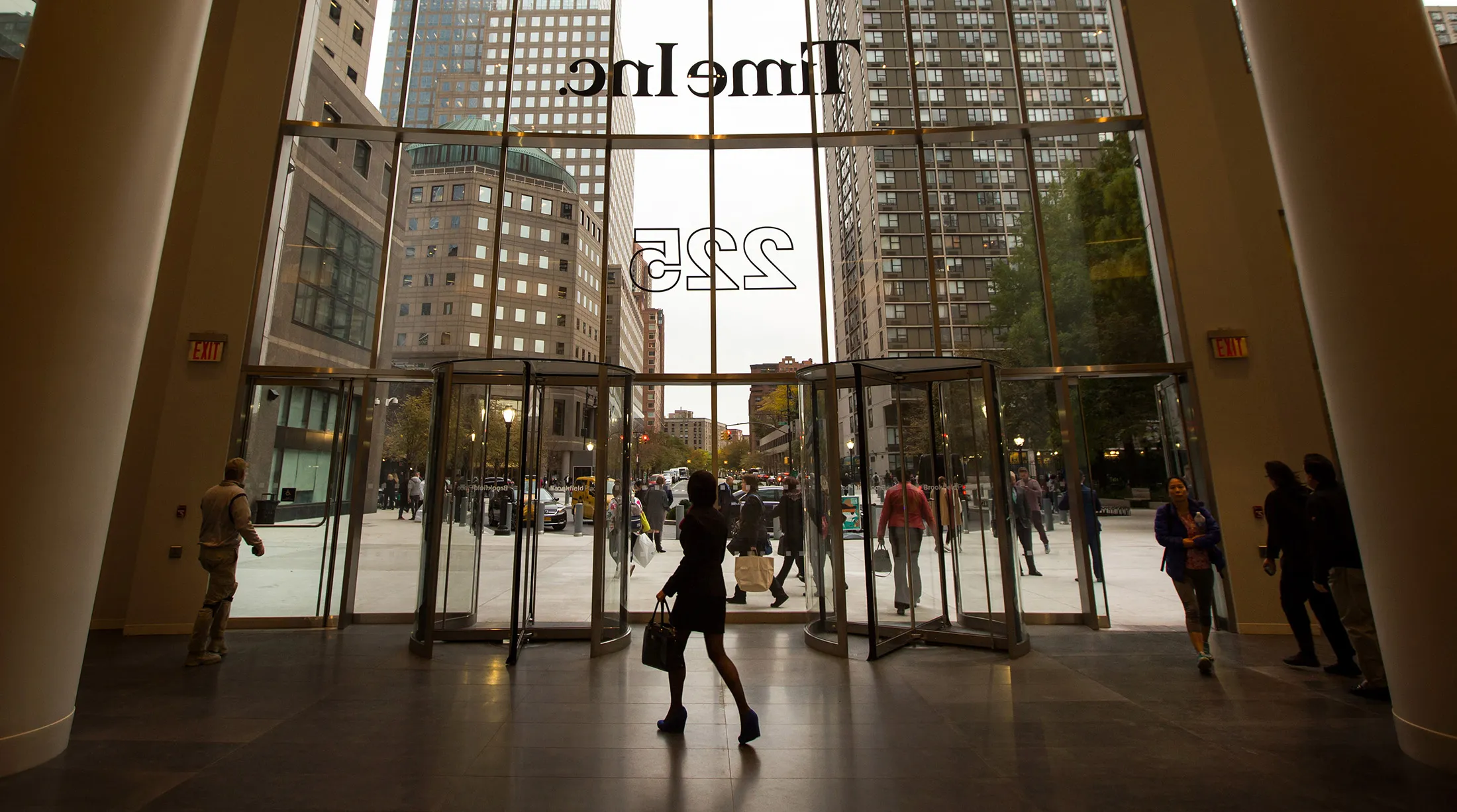People walk inside the headquarters of Time Inc. in New York.
