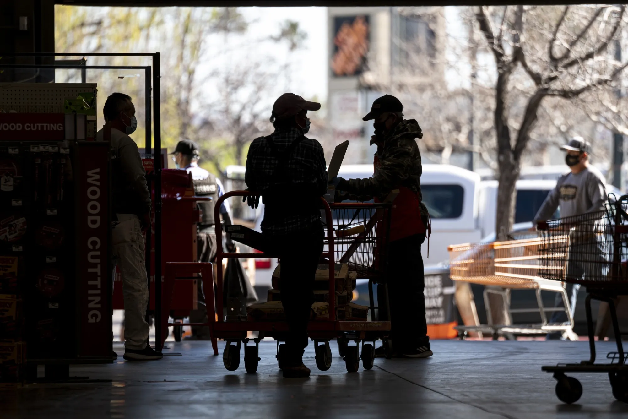 Customers wait to check out at a Home Depot store in Pleasanton, California.