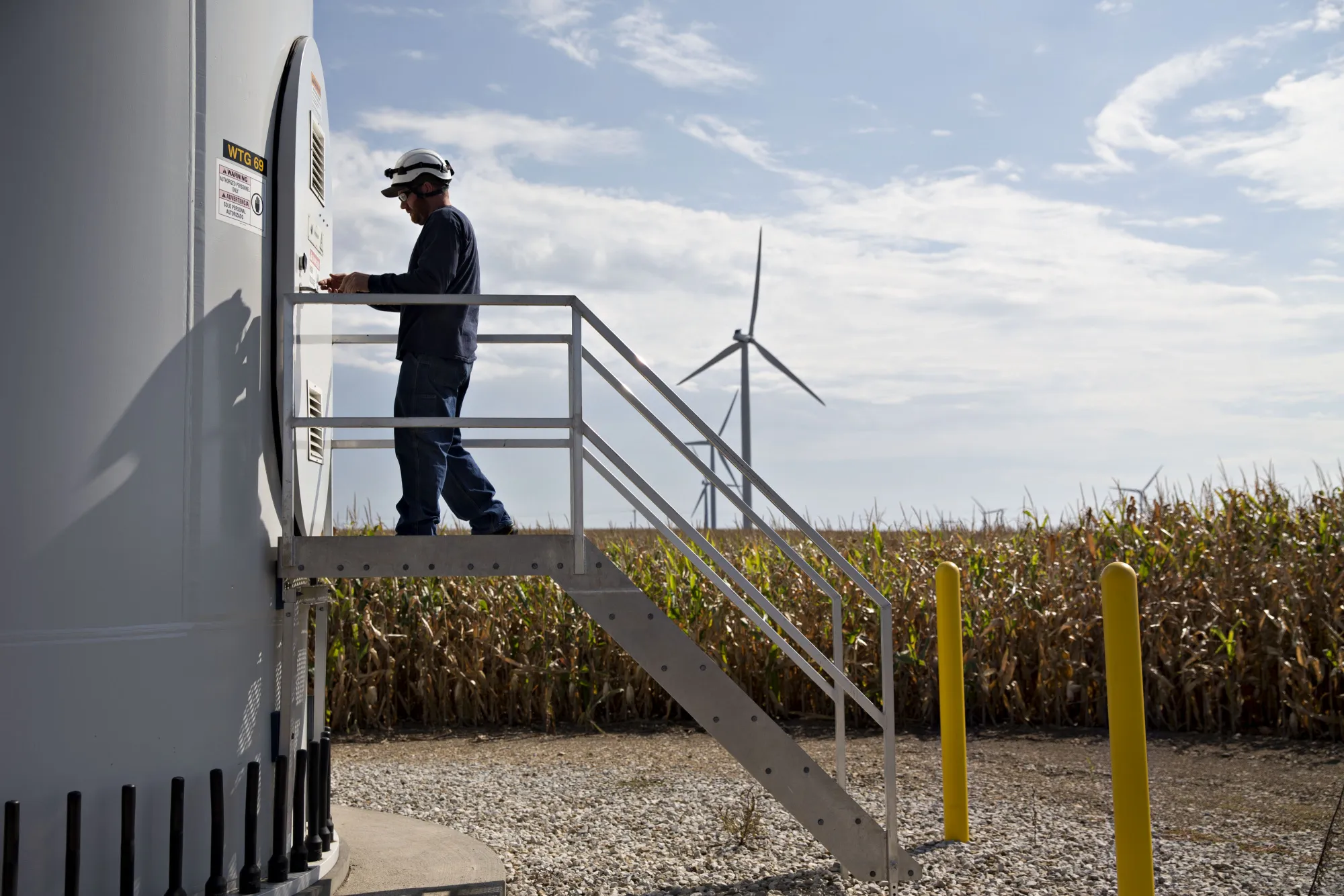 A technician enters a wind turbine&nbsp;in&nbsp;Iowa.