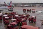 Workers on the tarmac amid American Airlines planes at Chicago O'Hare International Airport in Chicago on Nov. 9.