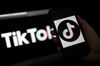 In this photo illustration, the social media application logo, TikTok is displayed on the screen of an iPhone on April 13, 2020.