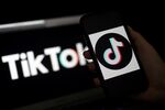 In this photo illustration, the social media application logo, TikTok is displayed on the screen of an iPhone on April 13, 2020.