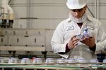 Inspecting yogurt containers at Chobani's plant in New Berlin, N.Y.