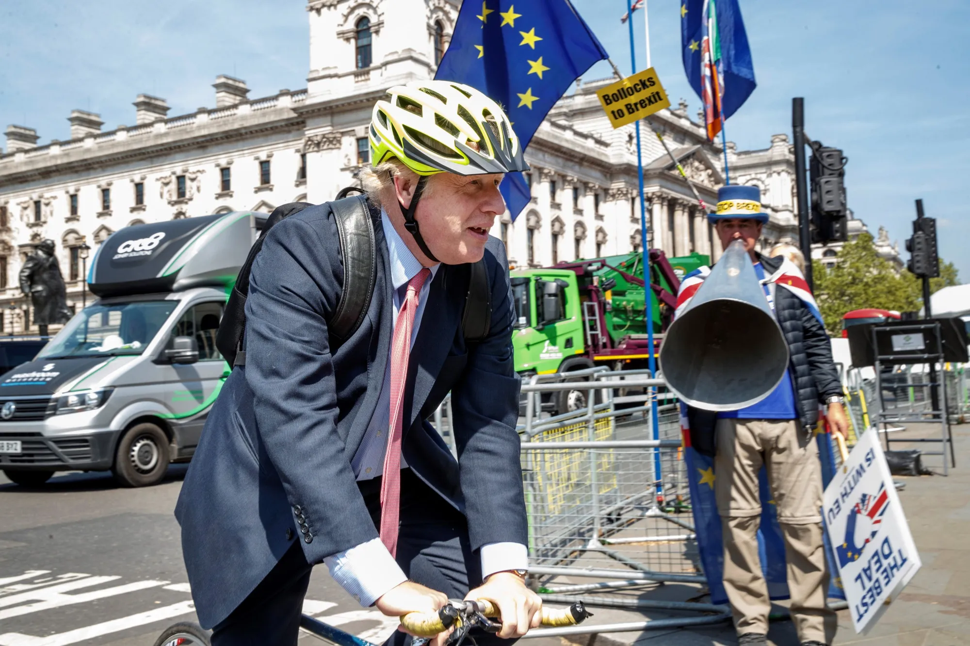 Boris Johnson on his bicycle as he arrives at the Houses of Parliament on May 15.
