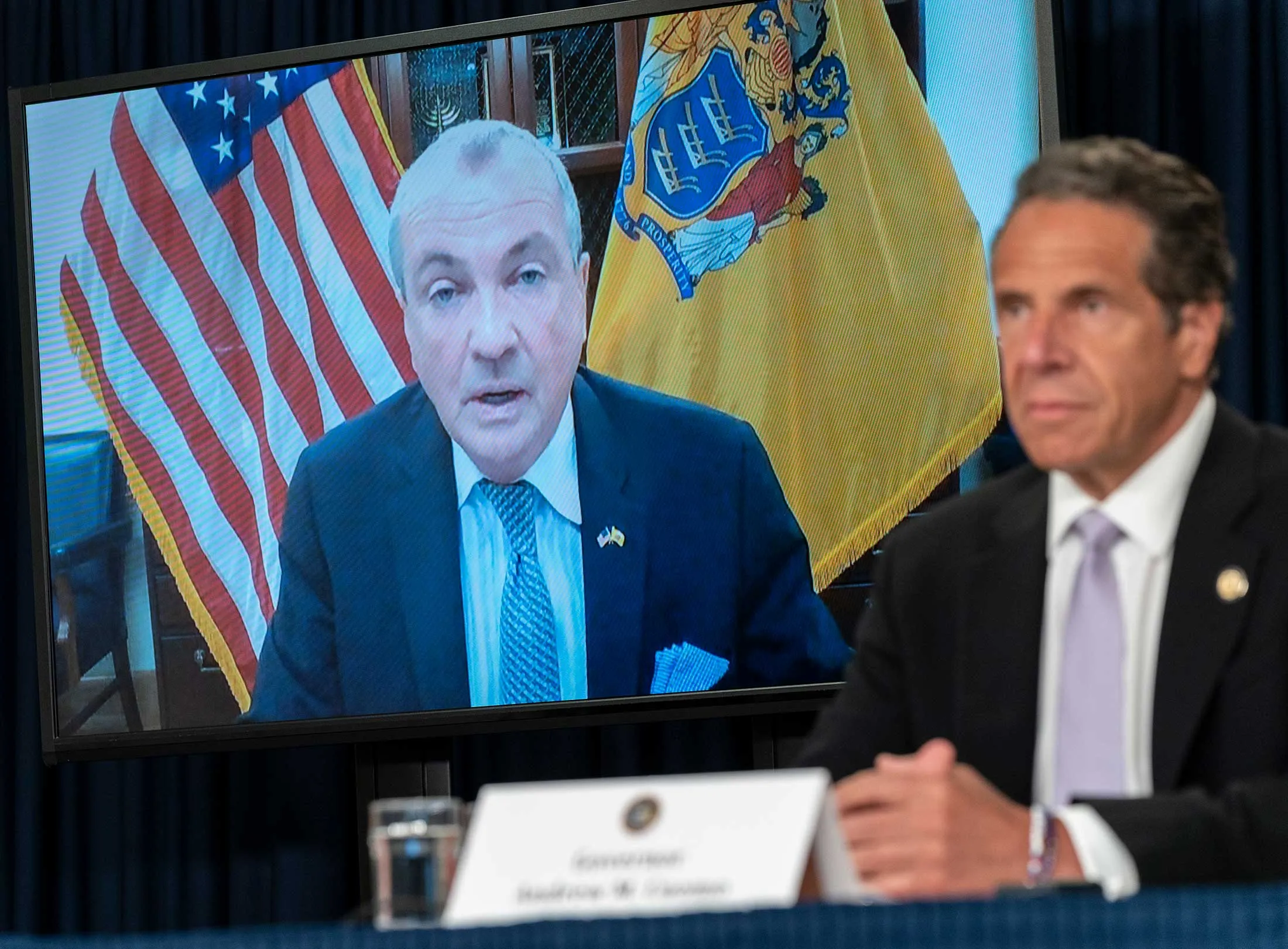 New Jersey Governor Phil Murphy (on screen) calls in to New York Governor Andrew Cuomo’s news briefing on June 24, 2020.