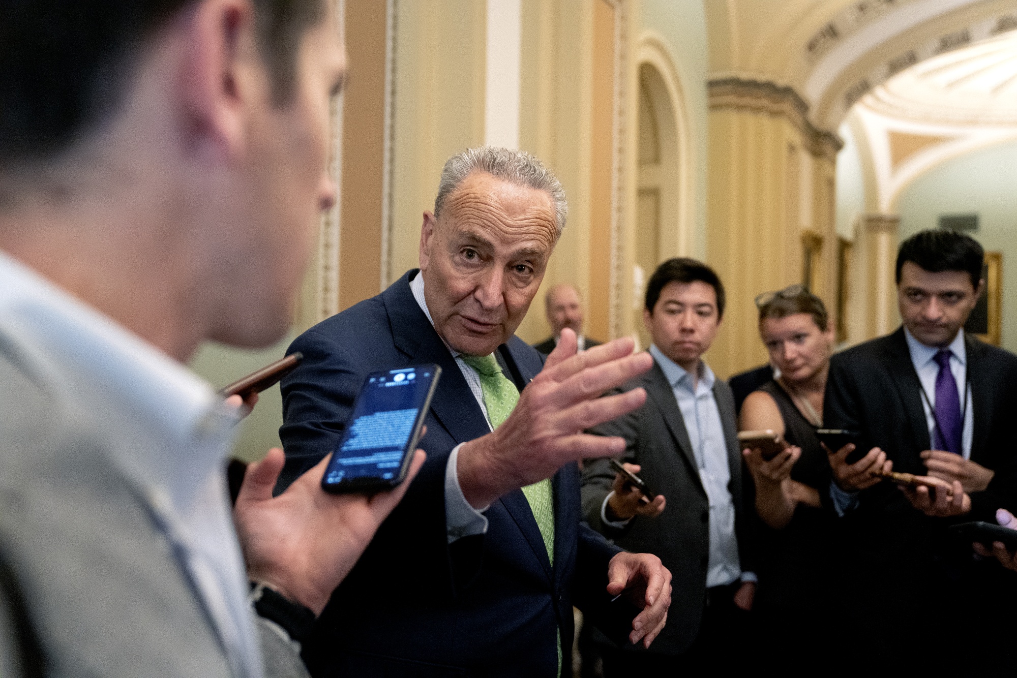 Senate Majority Leader Chuck Schumer, a Democrat from New York, center, speaks to members of the media at the U.S. Capitol in Washington, D.C.