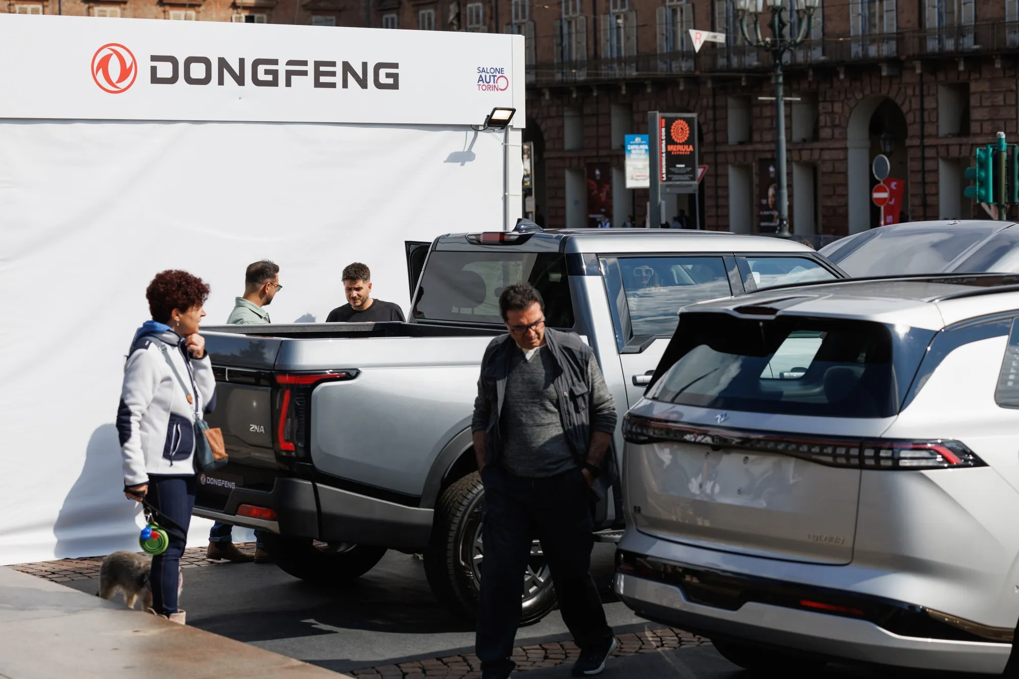 Visitors look at Dongfeng Motor Group Co. vehicles.