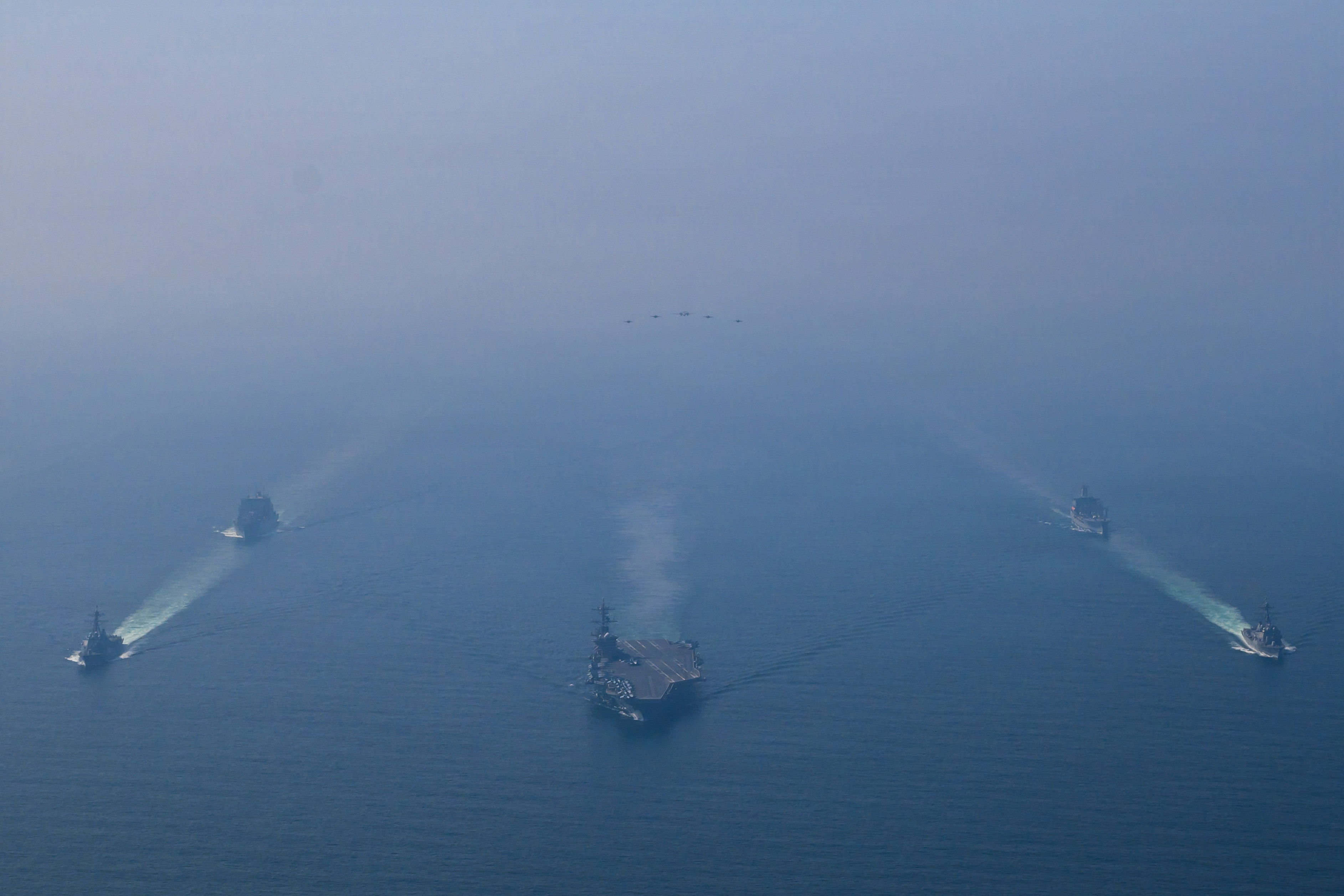 The USS Abraham Lincoln sails in formation with military ships in the Arabian Sea on Feb. 6, in an image provided by the US Navy.