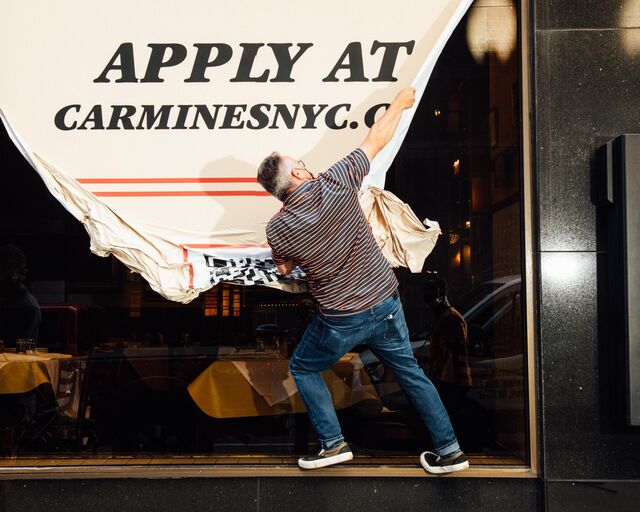 Signs are removed from the windows of Carmine's Italian Restaurant - Times Square location 