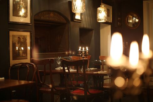 The basement dining room at Kitty Fisher's is cosy, like a country pub. It features historical details, such as an old bread oven.