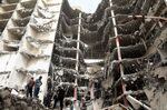 Iranians gather at the site of a collapsed building as rescue operations continue in the city of Abadan on May 24.