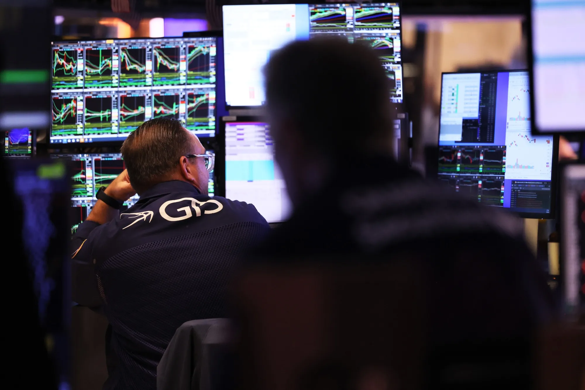 Traders work on the floor of the New York Stock Exchange.