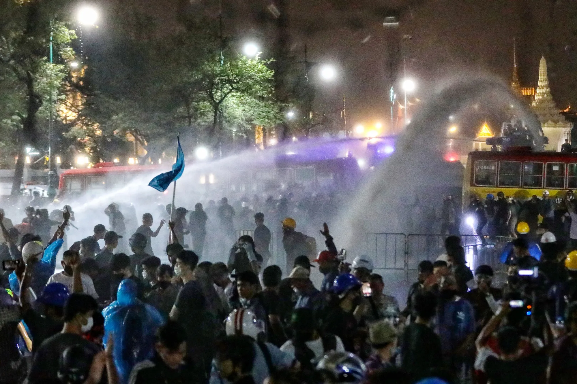 Police clash with protesters in Bangkok last Sunday. Anti-government protests have swept Thailand since July.