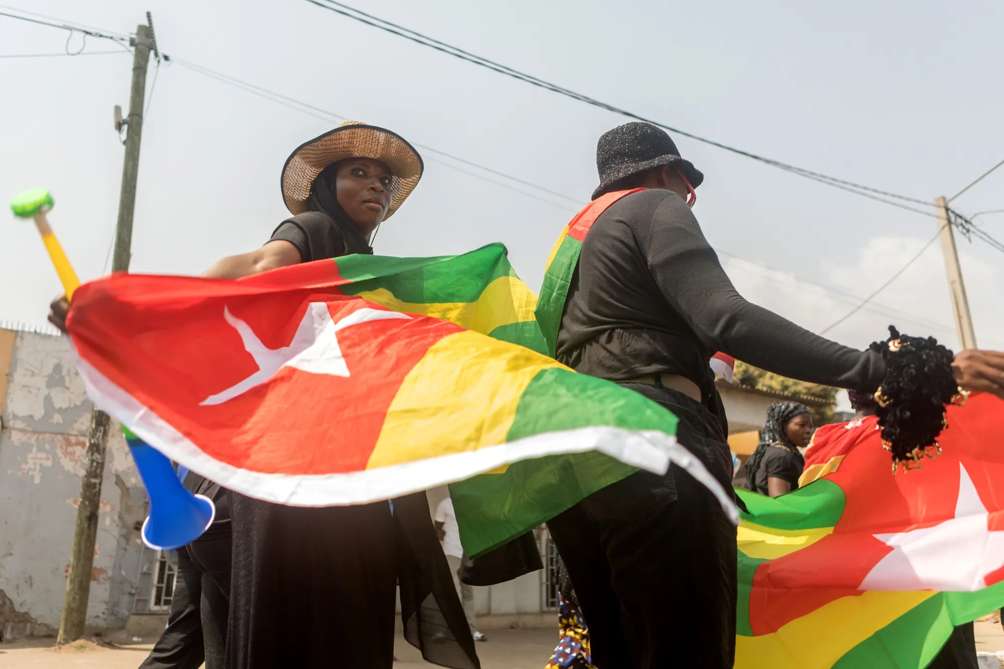 A Togolese woman holds the national flag during a protest in Lome.