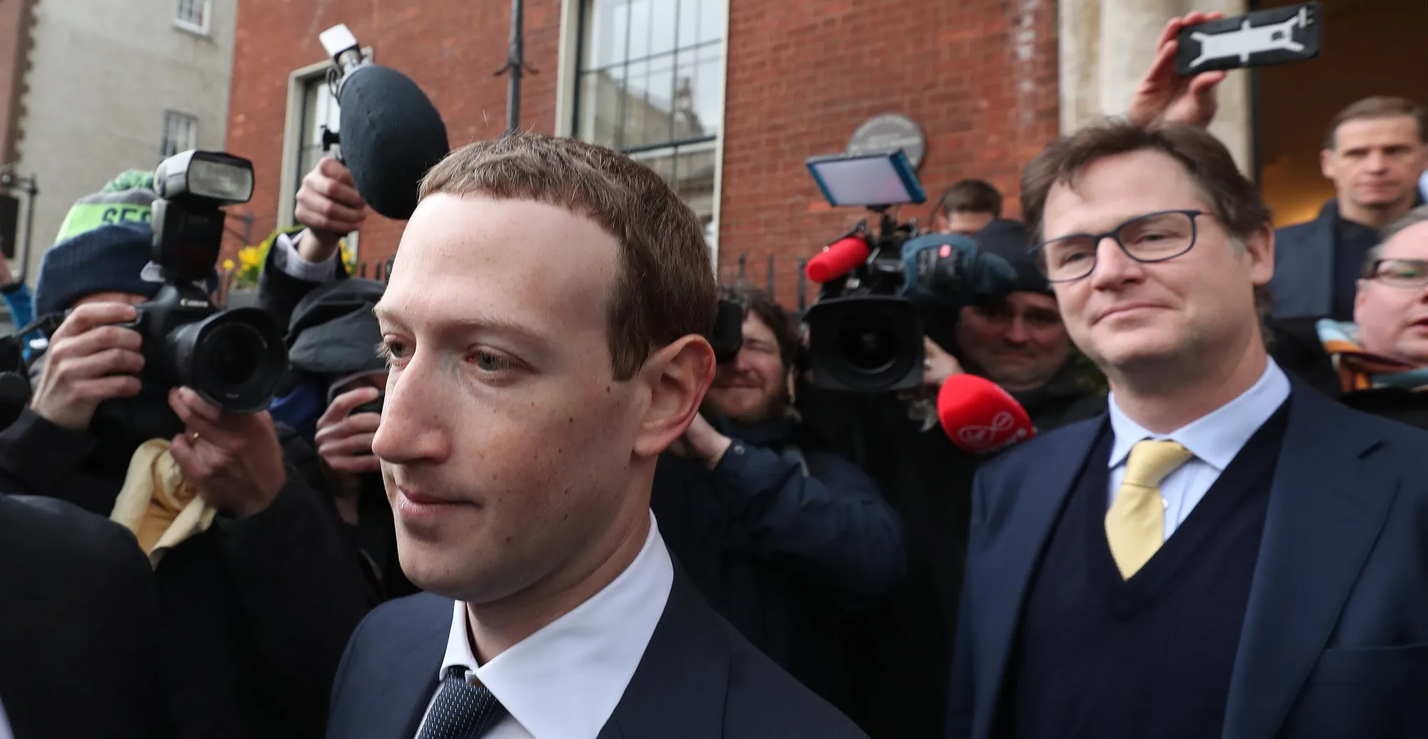 Mark Zuckerberg trailed by Nick Clegg after a 2019 meeting with politicians in Ireland.
