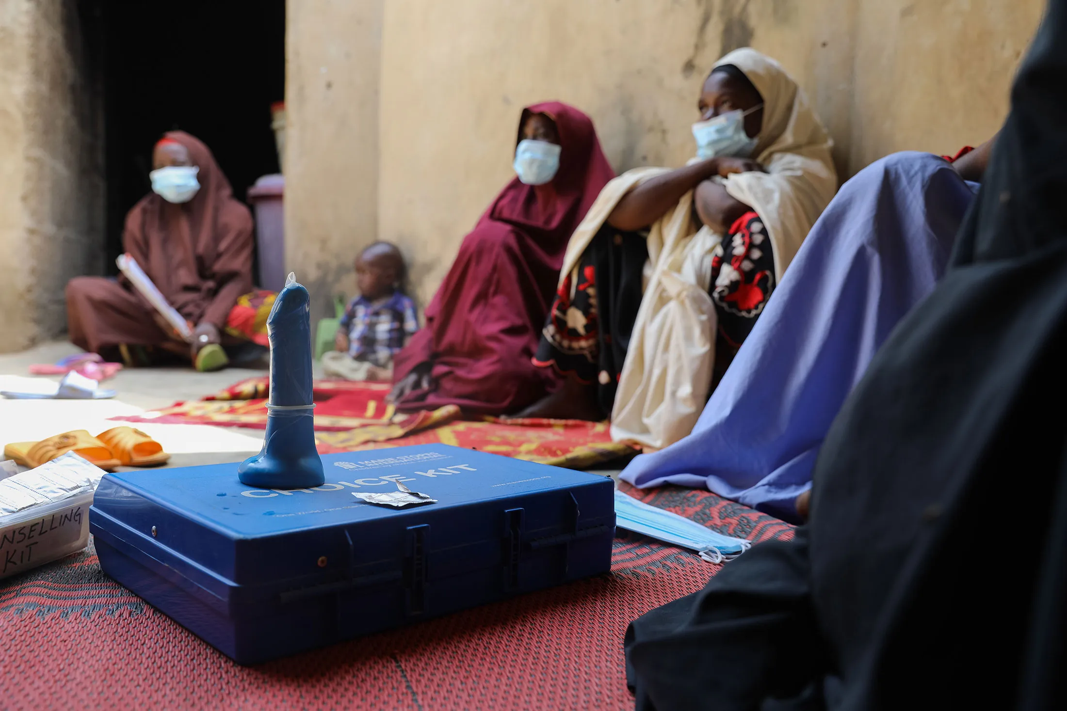 Women gathered at a village on the outskirts of Kano, northern Nigeria, for a discussion on family planning.