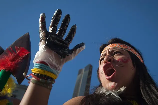 A protester from Ecuador demonstrating at Chevron's trial in New York on Oct. 15