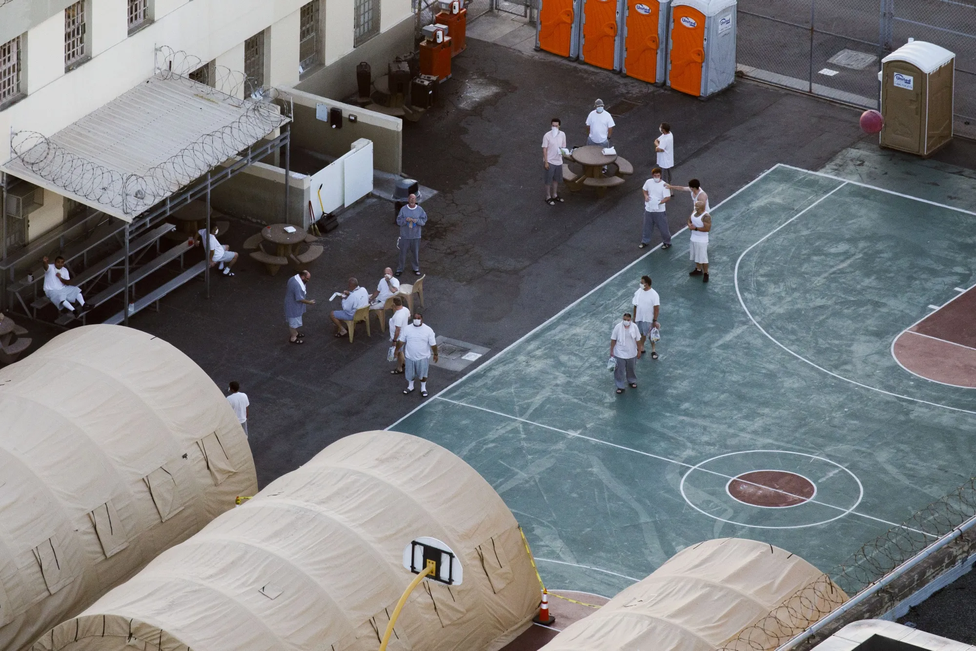 Inmates gather outside of tents at the Federal Correctional Institute (FCI) Terminal Island prison in&nbsp;Los Angeles, California, on&nbsp;May 1.&nbsp;