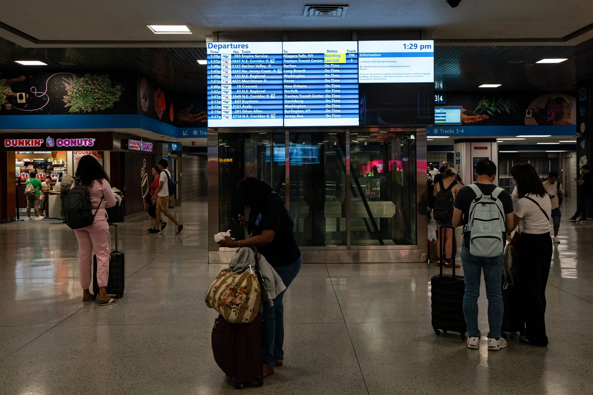 Travelers at Penn Station in New York.