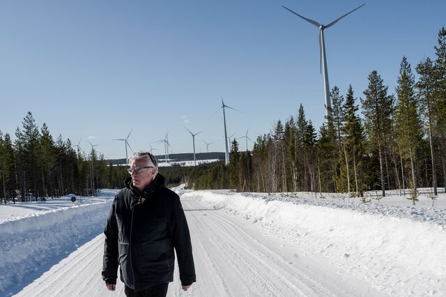 Person walking near wind farm