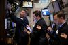 Traders work on the floor of the New York Stock Exchange (NYSE) in New York, U.S.