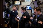 Traders work on the floor of the New York Stock Exchange (NYSE) in New York, U.S.