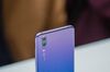 Three Leica Camera AG lenses sit on a P20 Pro smartphone, manufactured by Huawei Technologies Co..
