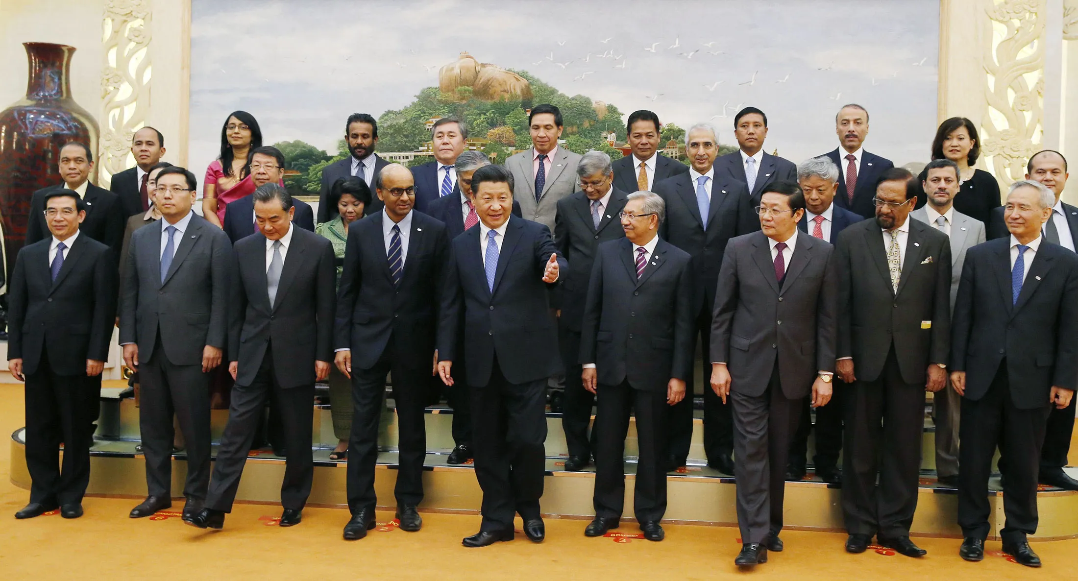 Chinese President Xi Jinping, center, and representatives of countries ready to join the Asian Infrastructure Investment Bank line up for a group photo at the Great Hall of the People in Beijing.

